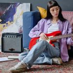 woman-using-guitar-to-write-new-song.jpg